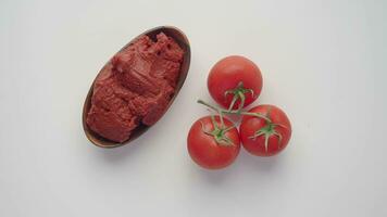 top view of Tomato paste with ripe tomatoes. video