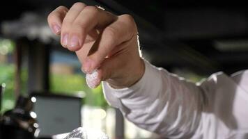 Bartender pouring salt over a glass for cocktail preparation video