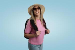 Front View Woman with Pink Hat in Blue Studio photo