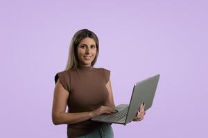 Fashionable Woman Standing in Studio with Colored Background photo