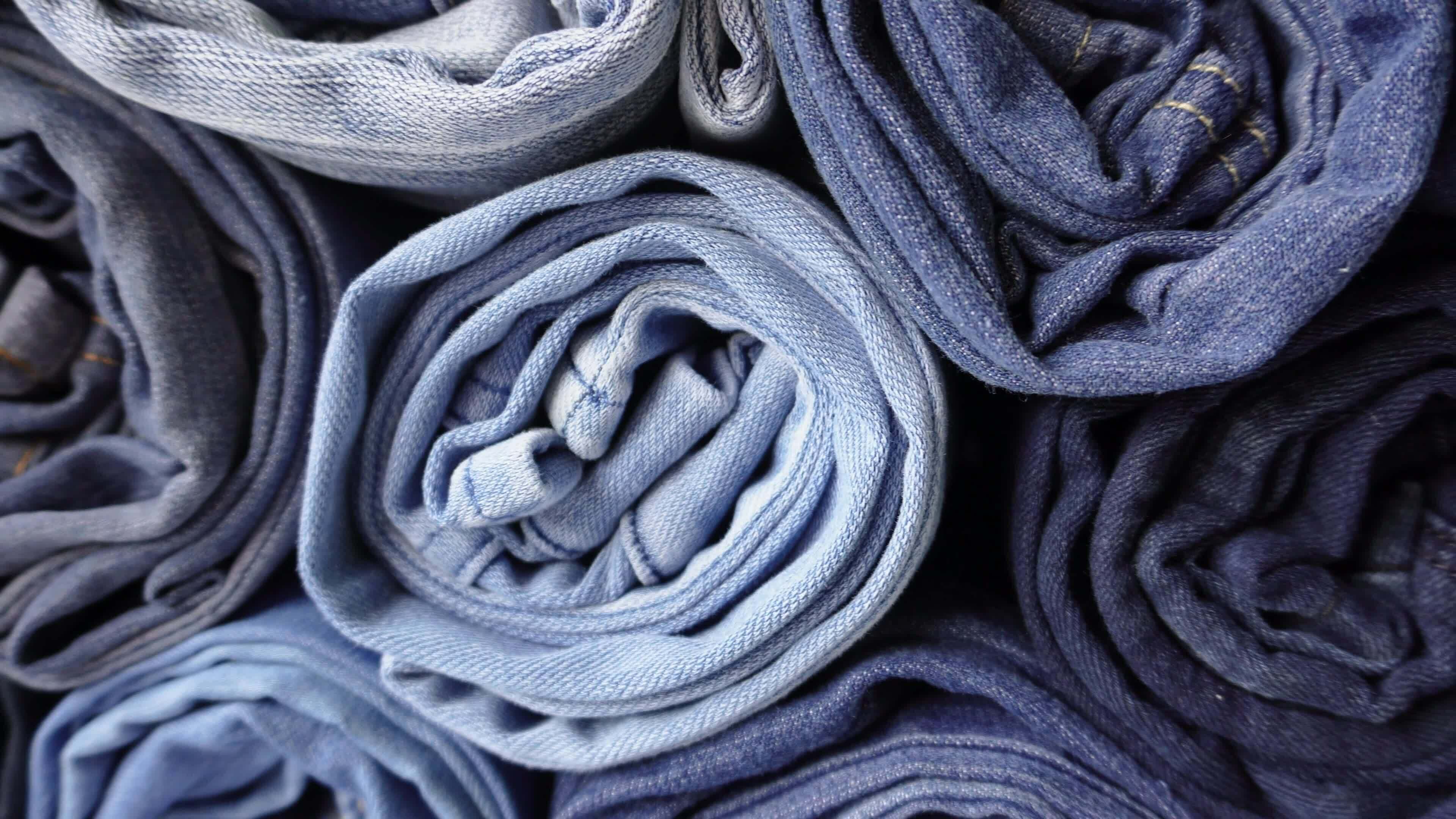 Stack of Various Shades of Rolled Up Denim Jeans 35141240 Stock Video ...