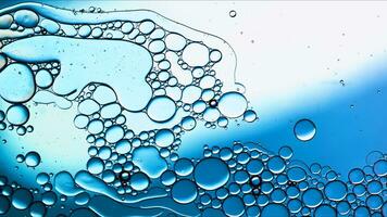 Abstract Colorful Food Oil Drops Bubbles and spheres Flowing on Water Surface photo