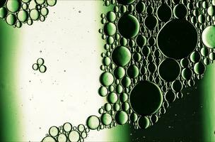 Abstract Colorful Food Oil Drops Bubbles and spheres Flowing on Water Surface photo