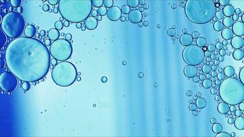 Abstract Colorful Food Oil Drops Bubbles and spheres Flowing on Water Surface photo