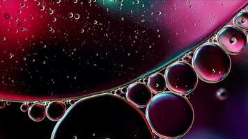 Abstract Colorful Food Oil Drops Bubbles and spheres Flowing on Water Surface photo