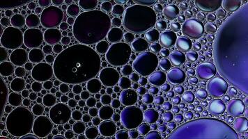 Abstract Colorful Food Oil Drops Bubbles and spheres Flowing on Water Surface photo