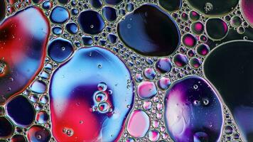 Abstract Colorful Food Oil Drops Bubbles and spheres Flowing on Water Surface photo