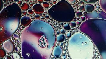 Abstract Colorful Food Oil Drops Bubbles and spheres Flowing on Water Surface photo