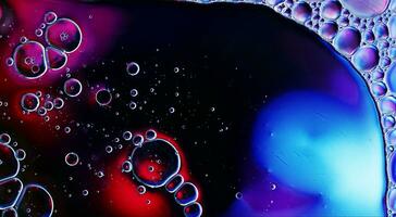 Abstract Colorful Food Oil Drops Bubbles and spheres Flowing on Water Surface photo