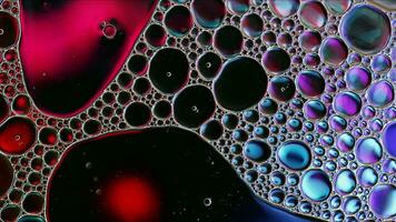 Abstract Colorful Food Oil Drops Bubbles and spheres Flowing on Water Surface photo