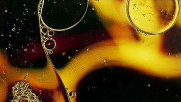 Abstract Colorful Food Oil Drops Bubbles and spheres Flowing on Water Surface photo