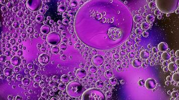 Abstract Colorful Food Oil Drops Bubbles and spheres Flowing on Water Surface photo