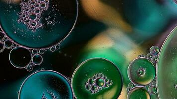 Abstract Colorful Food Oil Drops Bubbles and spheres Flowing on Water Surface photo