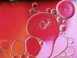 Abstract Colorful Food Oil Drops Bubbles and spheres Flowing on Water Surface photo