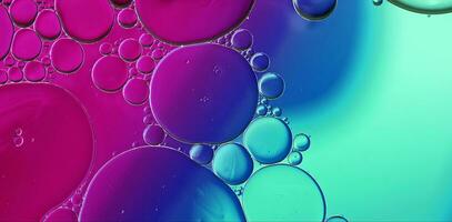 Abstract Colorful Food Oil Drops Bubbles and spheres Flowing on Water Surface photo