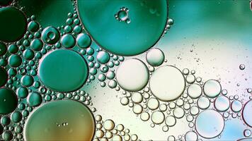 Abstract Colorful Food Oil Drops Bubbles and spheres Flowing on Water Surface photo