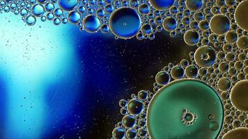 Abstract Colorful Food Oil Drops Bubbles and spheres Flowing on Water Surface photo