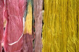 close up view of colorful threads photo