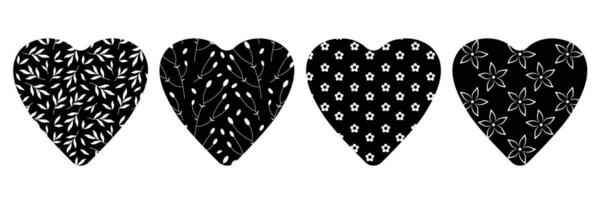 Set of hearts with plant elements. Vector illustration. Black and white silhouettes of hearts with flower pattern. Symbols of love.