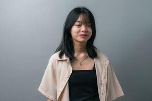 Happy Asian Teen Girl in Closeup Portrait on background. photo