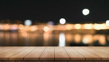 Empty wooden table top with lights bokeh on blur restaurant background. photo