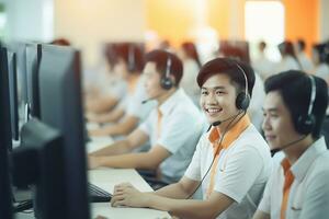 an asian people wearing a headset working in a call center photo