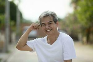 toothy smiling face of asian man good healthy photo