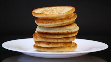 cooked sweet pancakes with honey in a plate video