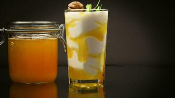 prepared homemade yogurt with natural honey in a glass video