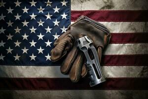 AI generated Composite image of gloves and gun on an american flag, Worn work glove holding old wrench and US American flag, AI Generated photo