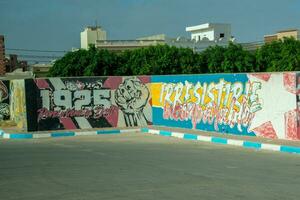 6.11.23 El Jem, Tunisia Street art  Political Graffiti on walls in City of El Jem Tunisia photo