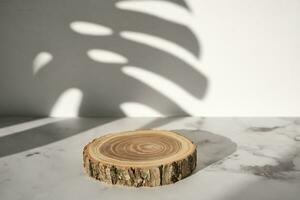 Wooden cut podium with monstera leaf shadow for natural cosmetics or products presentation photo