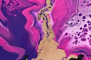 Fluid Art. Metallic gold abstraction on purple waves. Marble effect background or texture photo