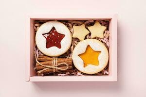 Eco Christmas Gift box with linzer cookies and cinnamon. Diy Sustainable present photo