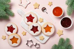 Traditional Linzer cookies with red and yellow jam. Cooking Christmas background photo