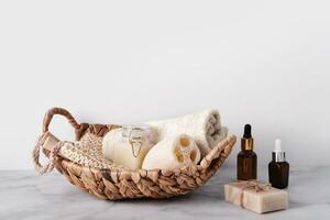 Bath accessories set in wicker basket. Sustainable personal hygiene items, copy space photo