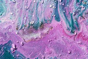 Fluid Art. Embossed strokes, craters and drips of violet paint. Marble effect background or texture photo