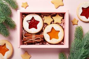 Eco Christmas Gift box with linzer cookies and cinnamon. Diy Sustainable present photo