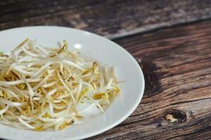 Bean sprouts of mung, maash. Traditional vegan dish in east Asia. Healthy diet food. photo