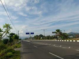 The white clouds on the blue sky are perfect for the background. Skyscape on Lombok Island, Indonesia photo