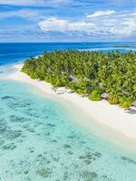 Sea beach aerial. Luxury summer travel vacation landscape. Tropical beach, drone view. Beach villas bungalows of hotel resort. Perfect beach scene vacation, summer holiday template. Wonderful nature photo