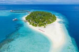 Maldives paradise scenery. Tropical aerial landscape, seascape, water villas with amazing sea and lagoon beach, tropical nature. Exotic tourism destination banner, summer aerial vacation, drone view photo