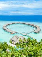 Maldives paradise scenery. Tropical aerial landscape, seascape, water villas with amazing sea and lagoon beach, tropical nature. Exotic tourism destination banner, summer aerial vacation, drone view photo