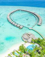 Maldives paradise scenery. Tropical aerial landscape, seascape, water villas with amazing sea and lagoon beach, tropical nature. Exotic tourism destination banner, summer aerial vacation, drone view photo