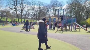 Cute Asian Pakistani Baby Ahmed Mustafain Haider is Enjoying The Beautiful Sunny Day at Wardown Public Park of Luton Town of England UK. Image Was Captured on 03-April-2023 video