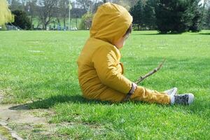 Cute Asian Pakistani Baby Ahmed Mustafain Haider is Enjoying The Beautiful Sunny Day at Wardown Public Park of Luton Town of England UK. Image Was Captured on 03-April-2023 photo