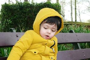 Cute Asian Pakistani Baby Ahmed Mustafain Haider is Enjoying The Beautiful Sunny Day at Wardown Public Park of Luton Town of England UK. Image Was Captured on 03-April-2023 photo