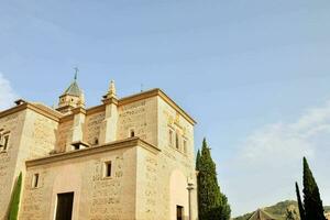 a church with a tower and a clock tower photo