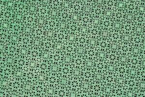 a green background with holes in it photo