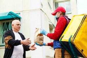 Grocery delivery service for elderly in quarantine at Covid-19 Coronavirus epidemic photo